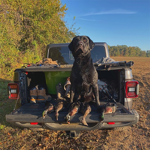 Adam loves spending time outdoors with his favorite four-legged friend.