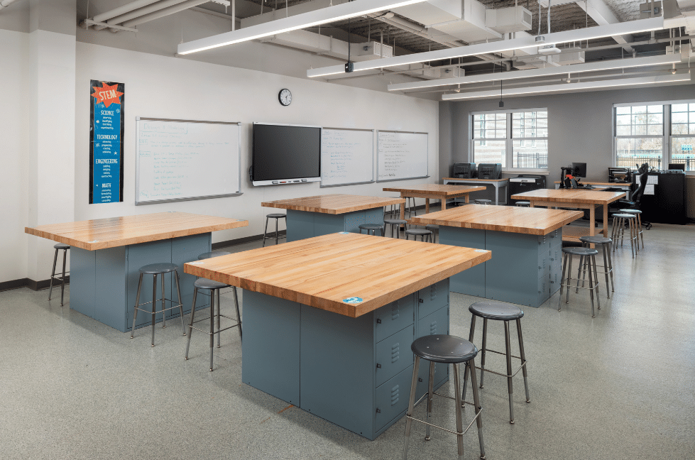 Classroom designed and constructed for STEM learning, with lab tables and a smart board